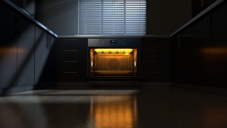 Open oven with lights on at a distance in a kitchen at night