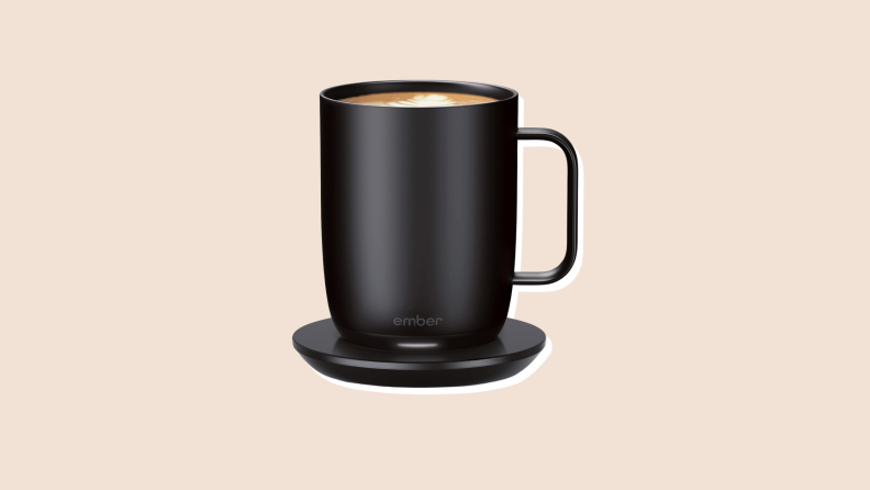 A Black Ember Mug 2 temperature-controlled smart mug against a beige background.
