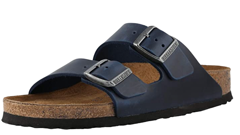 A single dark blue Birkenstock sandle.