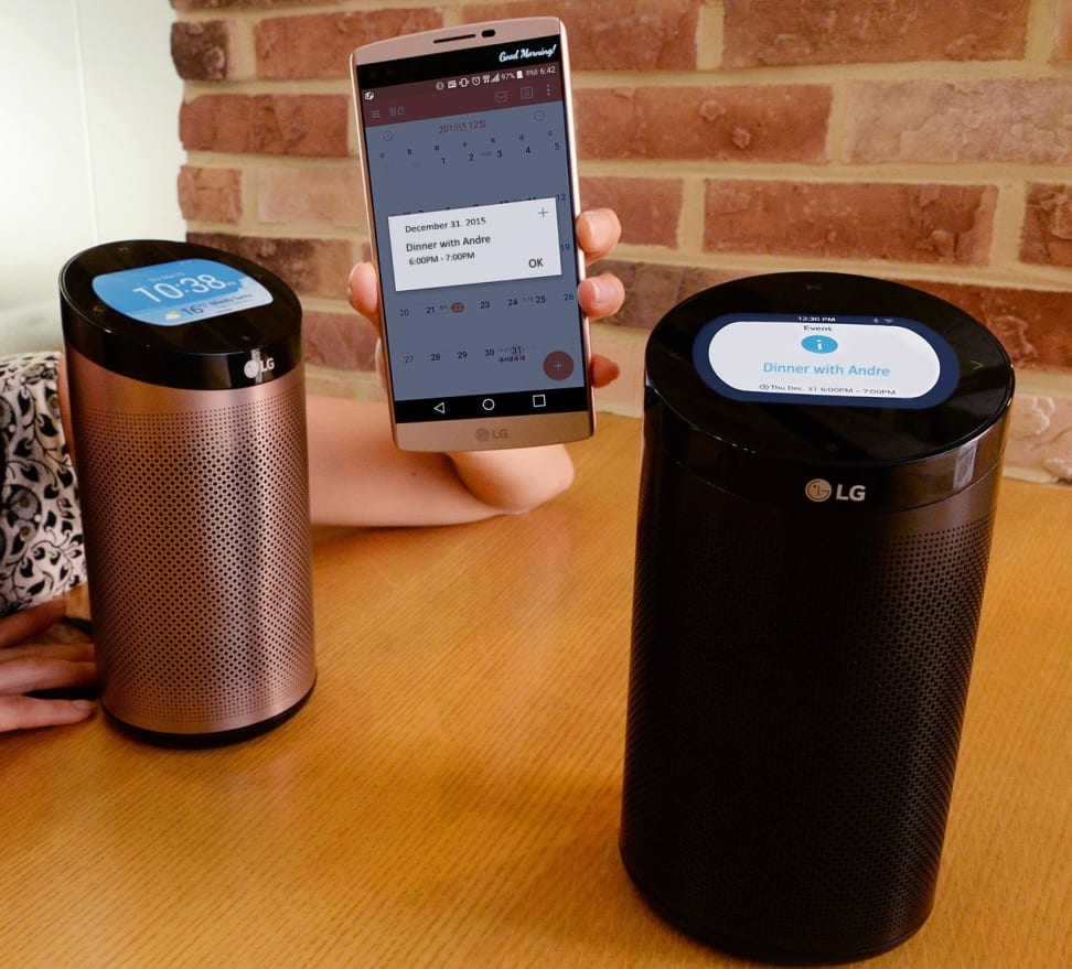 Two LG SmartThinQ hubs with a smartphone