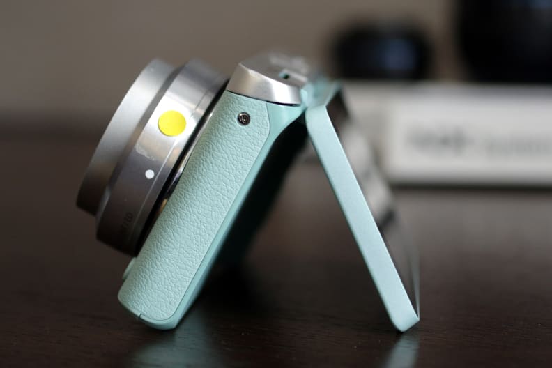 The NX Mini is thin, but the screen still has touch capability and flips out to face your subject.