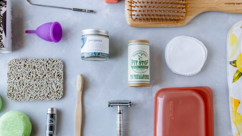 Scrubbers, soap, and toothbrushes sit on a surface.