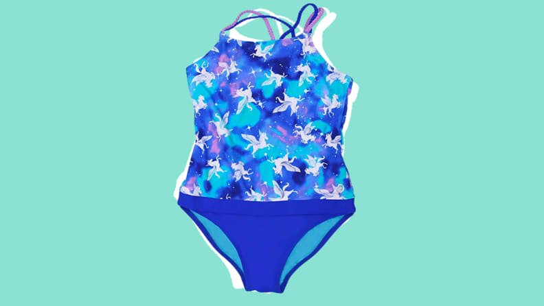 A blue one-piece swimsuit on a green background.
