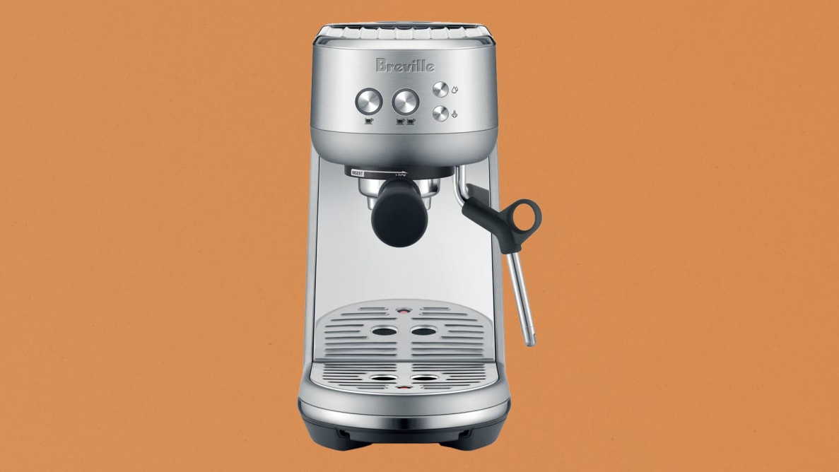 Breville Bambino espresso maker on brown paper-like background