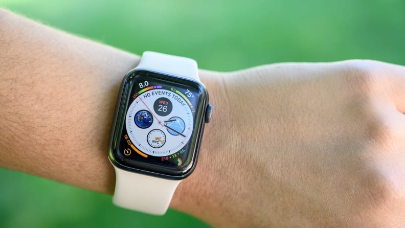 A person checks their Apple Watch.