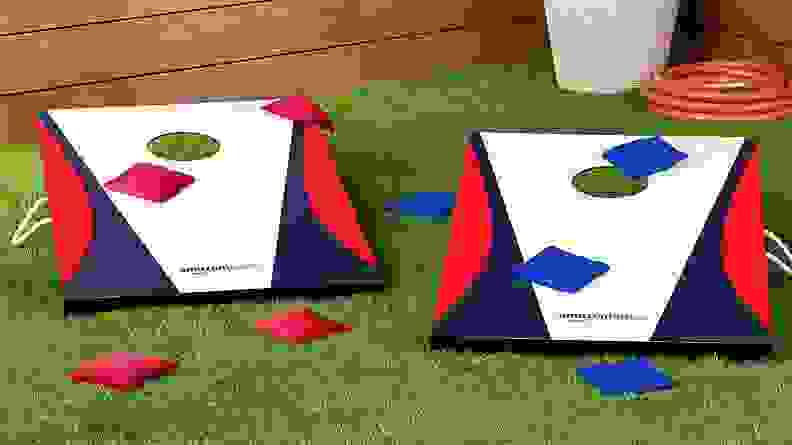 Close up of a cornhole game outside.