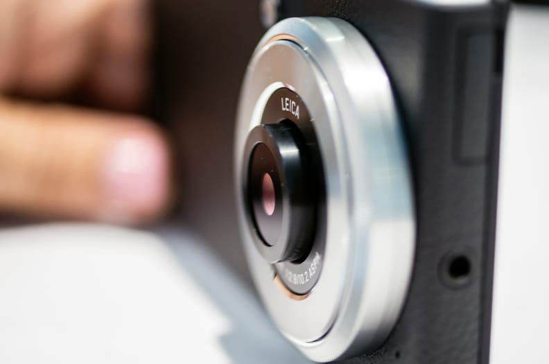 The lens pops out slightly while in camera mode and retracts while not.