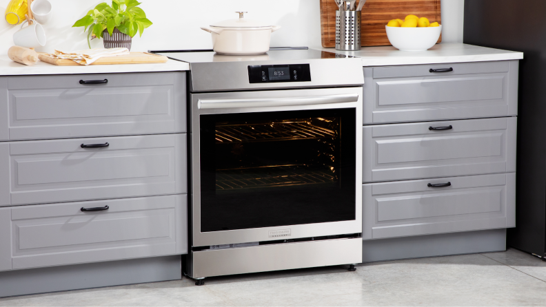Frigidaire Gallery GCFI3060BF 30-inch Induction Range in between two drawers in modern kitchen setting.