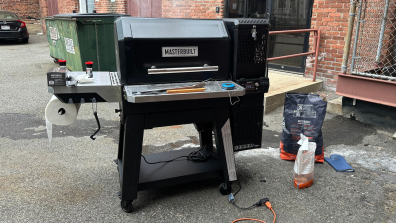 Masterbuilt grill set up in an outdoor parking lot