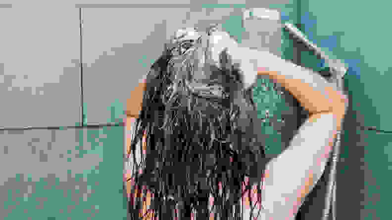 A photo of a woman showering.