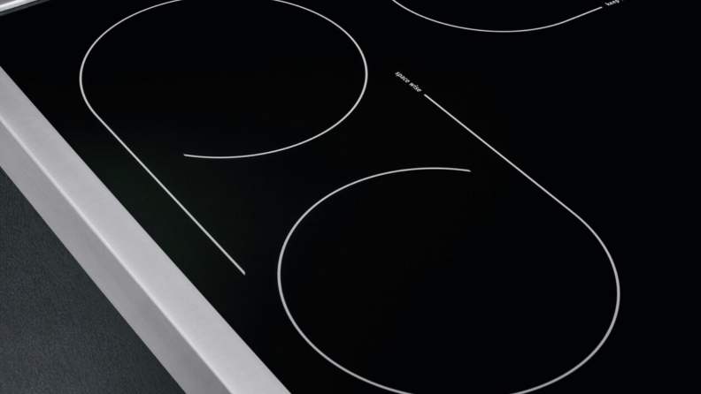 A close up look at the Frigidaire Professional electric range's cooktop, which features two rings that can be combined into one in order to use a oddly shaped cookware.