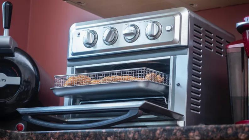 Close up of an air fryer toaster oven.
