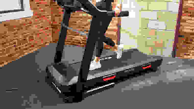 A runner paces on the belt of the Bowflex BXT8J treadmill.