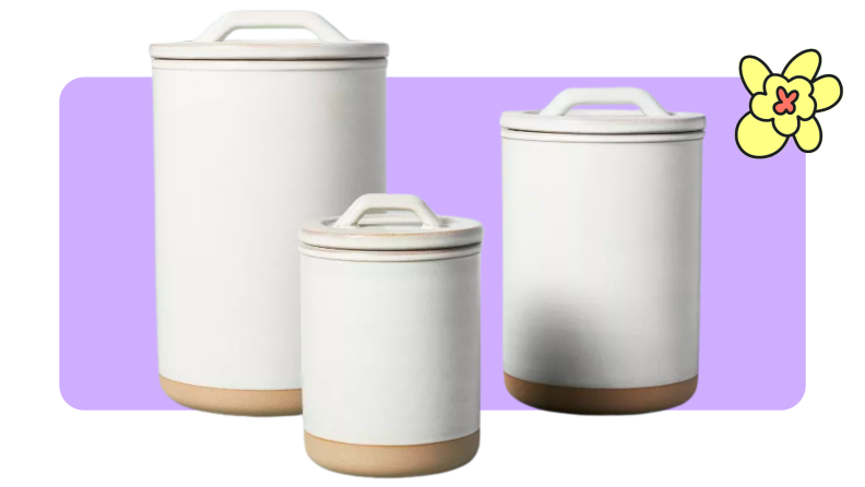 Three white Hearth and Hand stoneware storage canisters in various sizes.