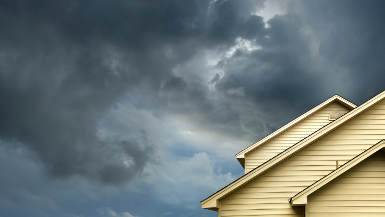 Dark, cloudy sky in back of house.