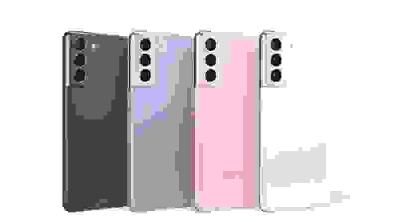 Four multi-colored smartphones lined up together in front of white background.