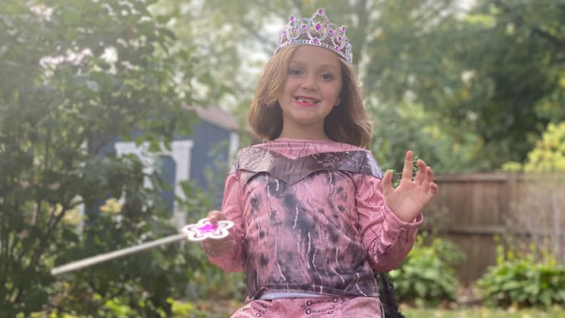 A girl wearing an Audrey from Descendants 3 costume