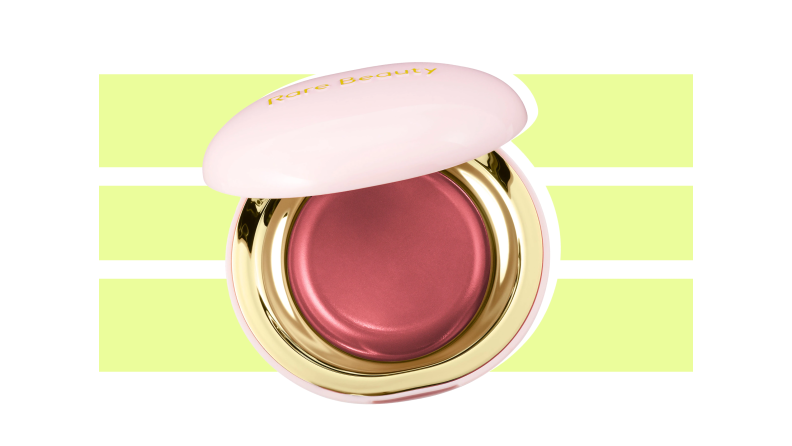 Rare Beauty Stay Vulnerable Melting Cream Blush against a green and white background.