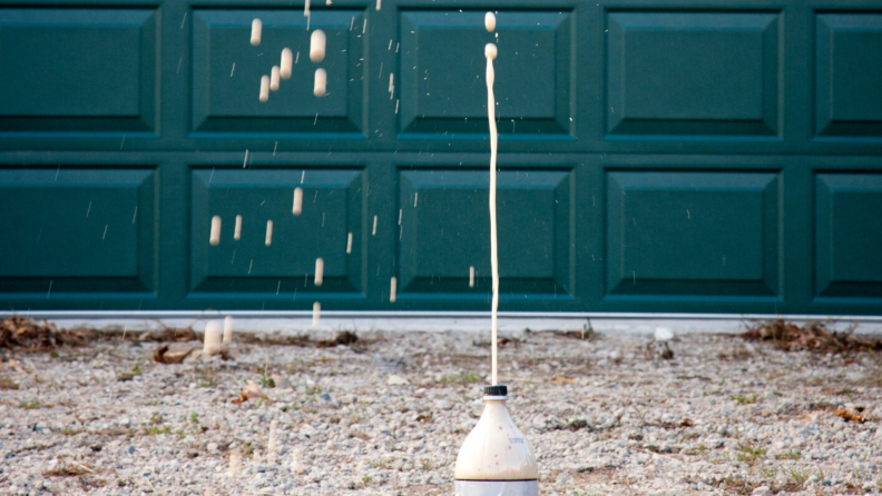 Soda exploding out of a bottle