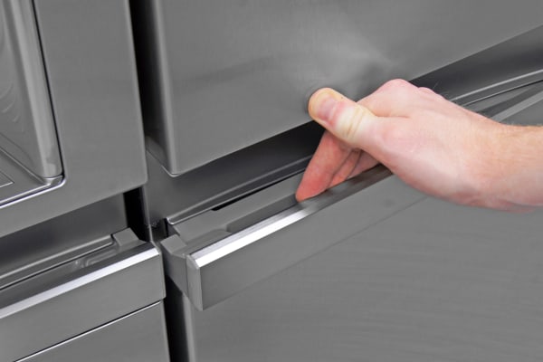 The LG LSC22991ST's handles use a hinge similar to what you'd find on a car door.