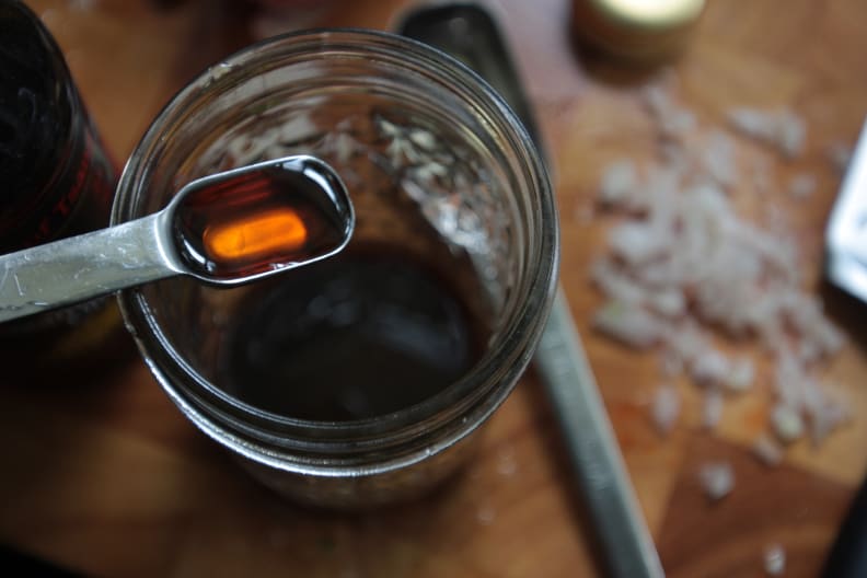 Sesame oil and spoon