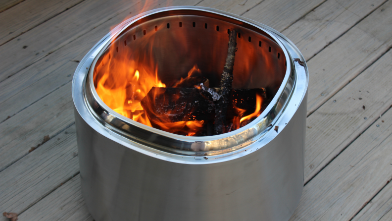 The empty East Oak Fire Pit shown from above with many vent holes in the bottom.