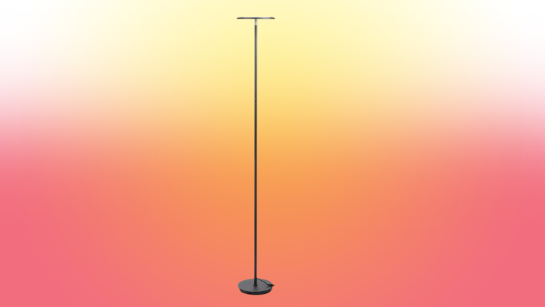 A lamp stands on a red and yellow fade background