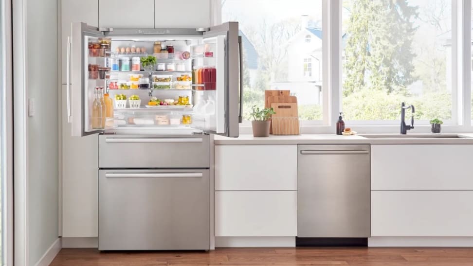 Bosch B36CL80SNS stainless steel fridge open in a kitchen.