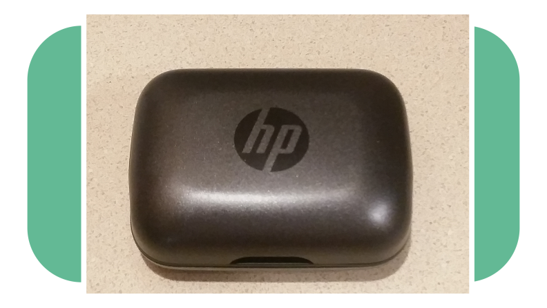 HP Hearing Pro OTC hearing aid charging case on countertop surface.