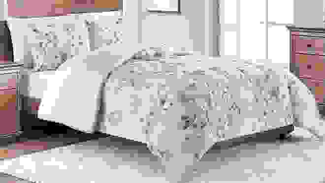 Pink and purple flowered comforter