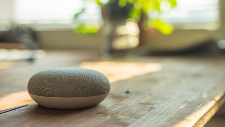 Smart speaker sitting on counter in home.