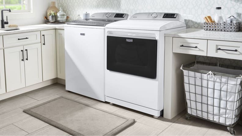 White Maytag MED7230HW dryer with matching washer in laundry room.