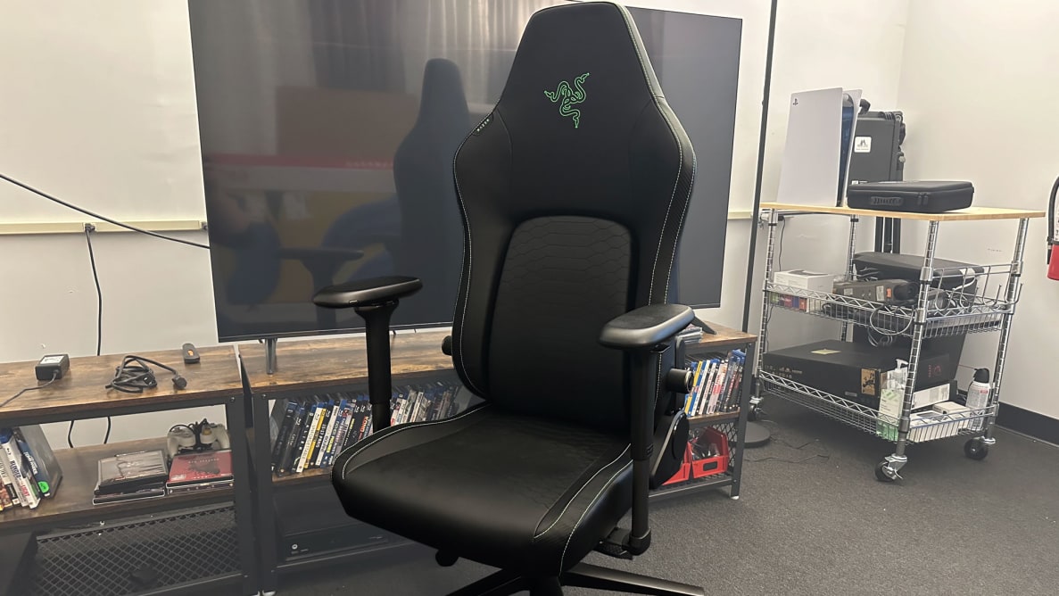 A close-up of the Razer Iskur V2 gaming chair in a media room.