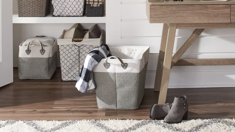 A room with a storage basket on the floor