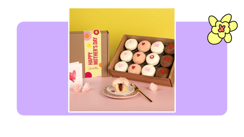 A box of Mothers Day cupcakes from Sprinkles on purple background