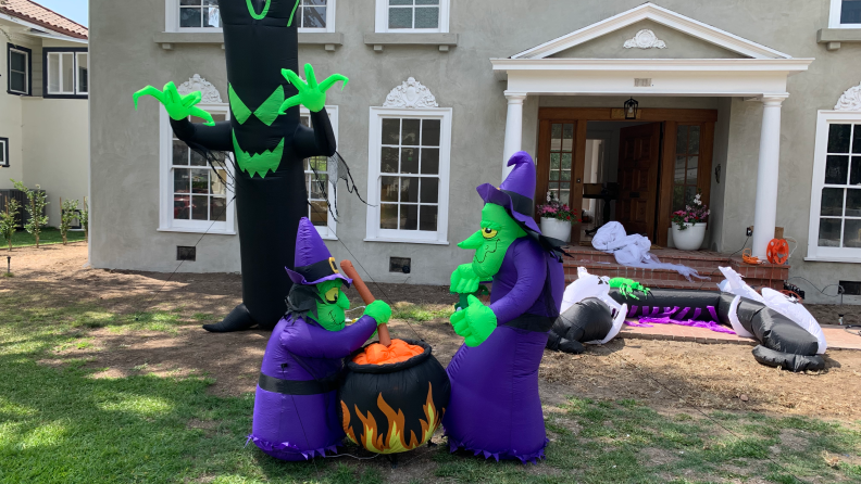 Halloween inflatables on a front lawn of a house