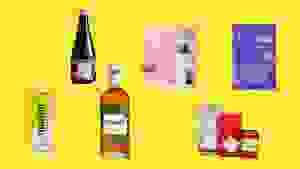 Various colorful beverage containers arranged against a yellow background.