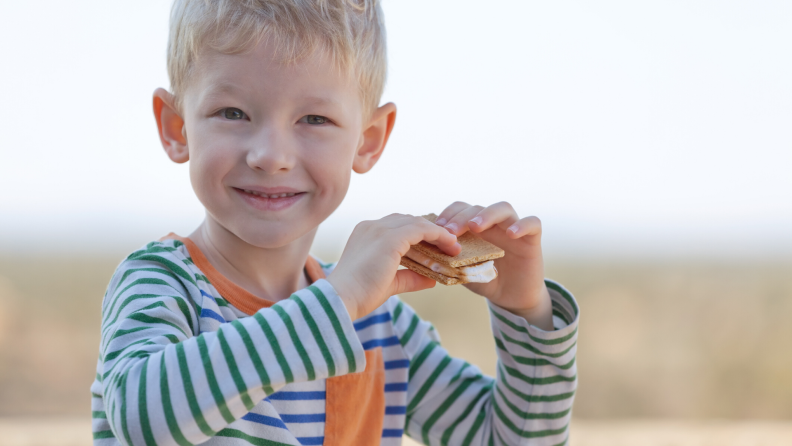 Boy eating a s'more