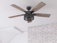 A Honeywell ceiling fan hangs from a white ceiling.