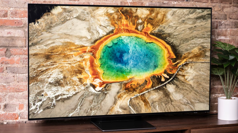 The 55-inch Samsung S95B QD-OLED displaying 4K/HDR content in a living room setting.