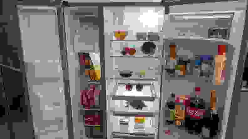 Inside shelving on the Whirlpool WRS331SDHM filled with assorted foods.