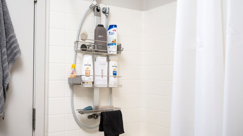 Simplehuman Adjustable Shower Caddy hangs in a tiled shower
