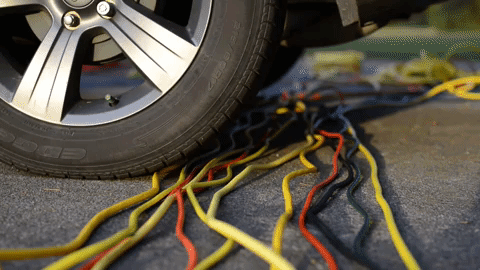 Testing outdoor extension cords by running them over with a Jeep.