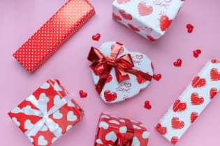 Valentine's Day gifts on a pink background.
