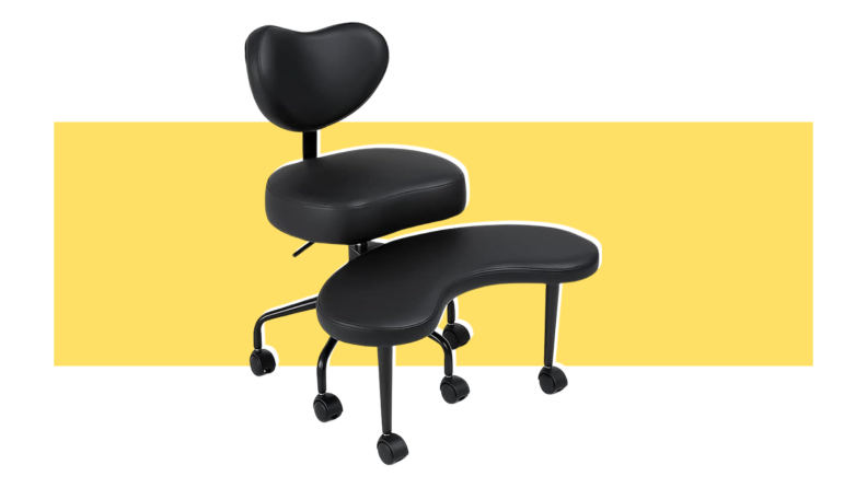 A black, leather Pipersong Meditation Chair with wheels on the bottom in front of yellow background.