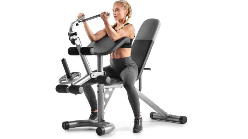 A person works out using the Weider XRS 20 adjustable Olympic workout bench.