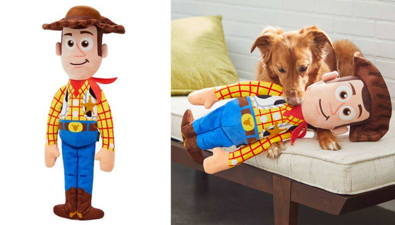 Toy story woody figurine with dog holding it