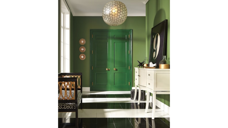This deep green door is painted with Sherwin-Williams-Arugula