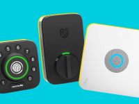 Two smart locks and a smart doorbell on display in front of a background.
