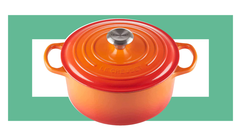 An orage Le Creuset Dutch oven